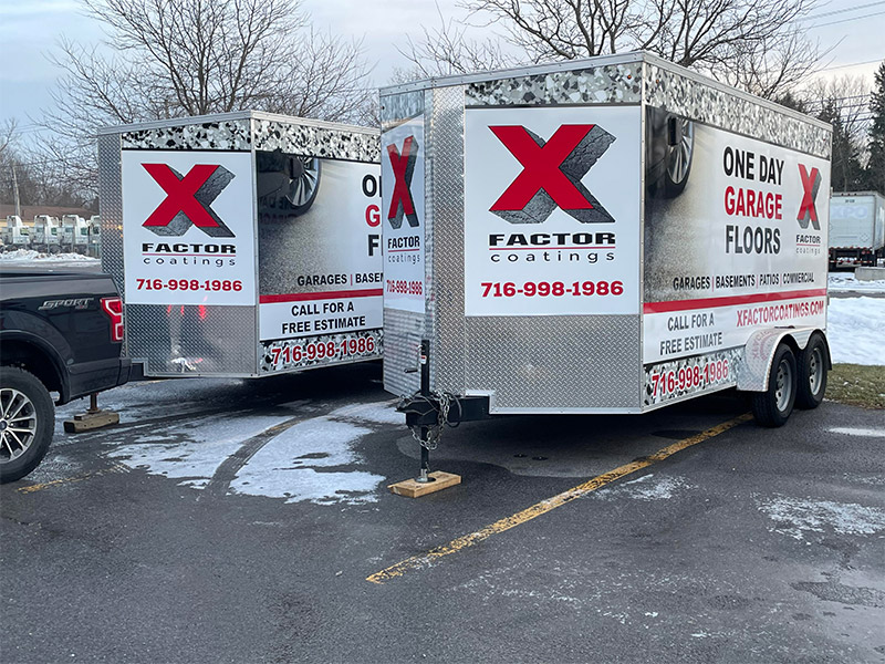 X Factor concrete coatings trailers wrapped with a bright red "x" logo, ready to apply concrete coatings in New York and Florida.